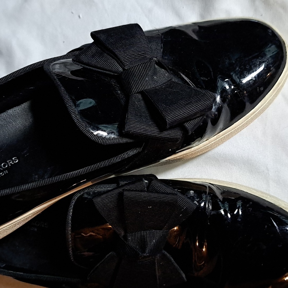 Women's Micheal Kors patent leather slip on type gymshoe size 7